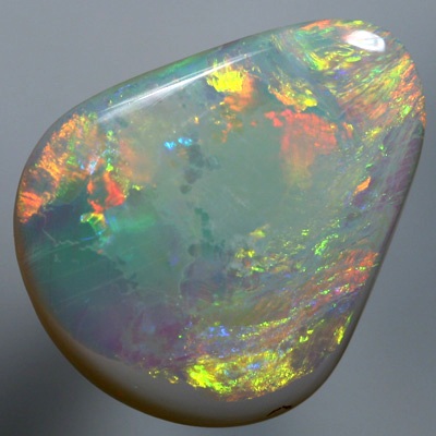 SOLID SEMI BLACK OPAL Large opal with rolling flasehs of orange SEE VIDEO